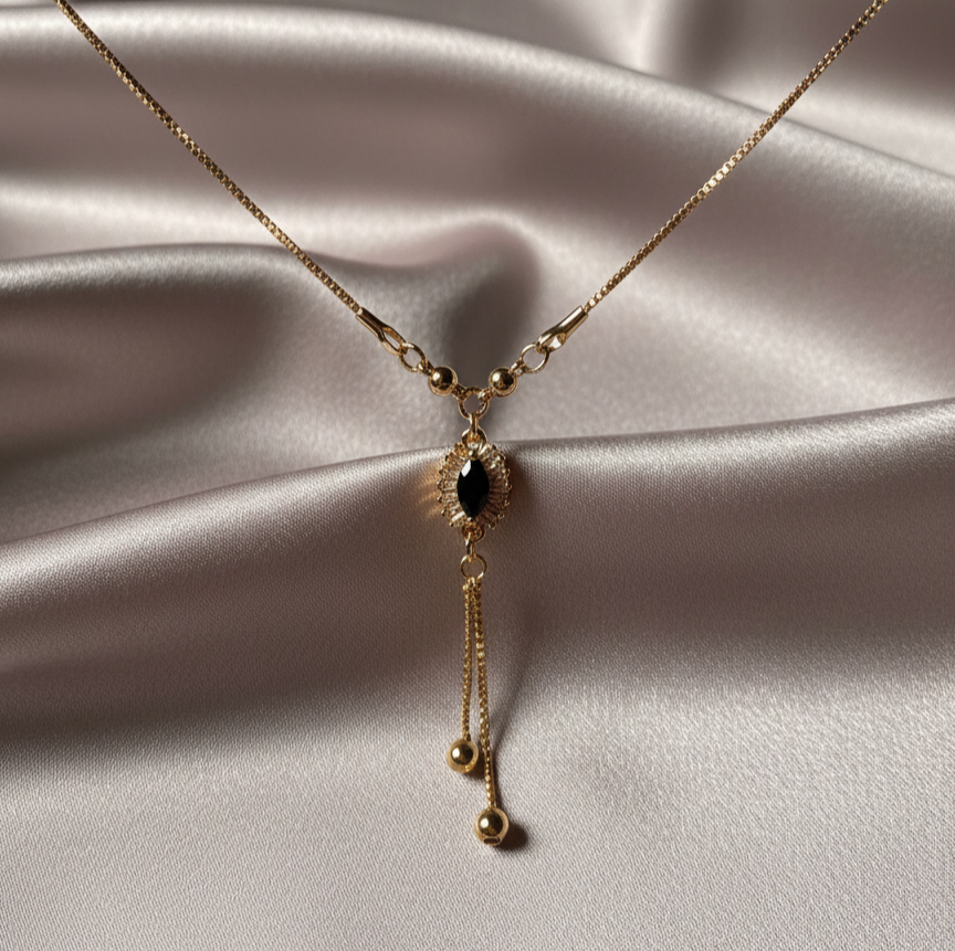 Gold Y-necklace with black stone pendant